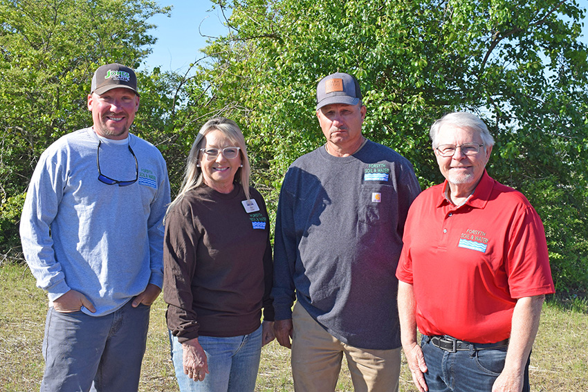Board members standing outsite