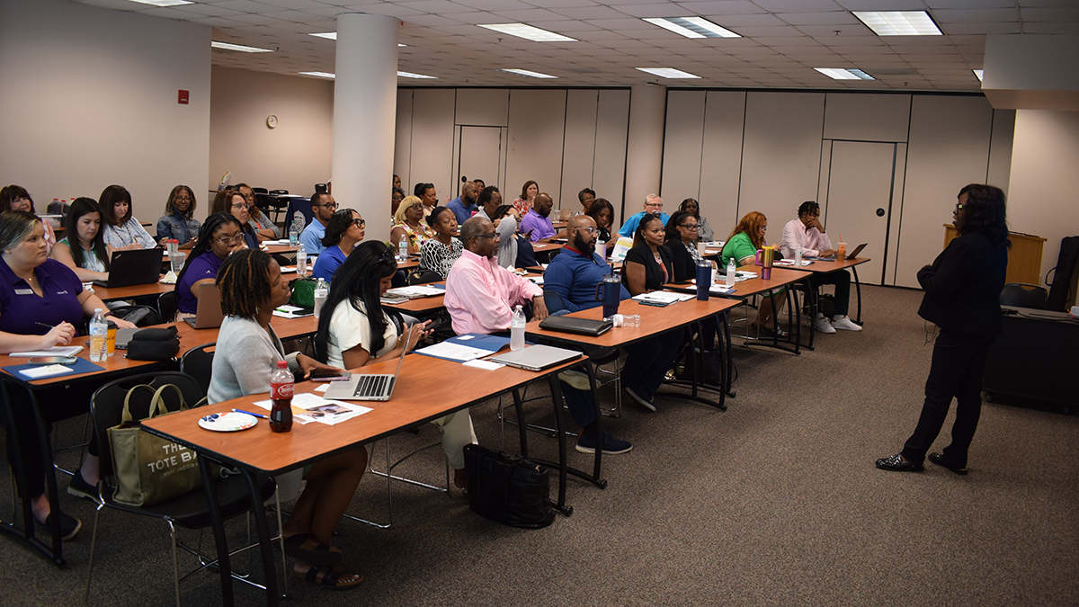 CED staff holding a downpayment assistance training class